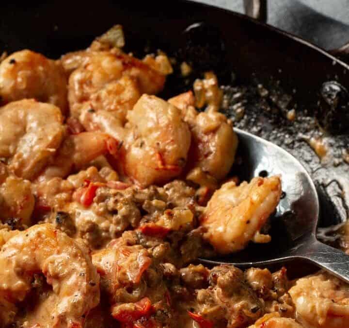 A skillet of shrimp with the sauce.