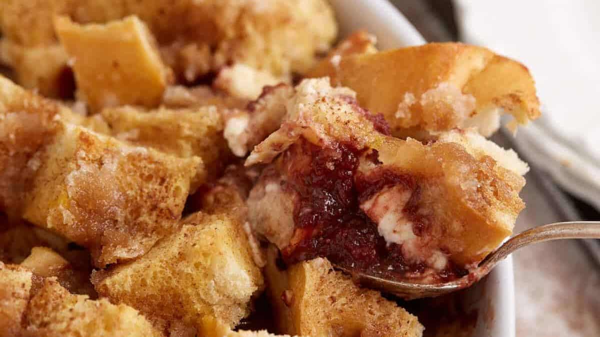 A spoon full of overnight baked French toast.