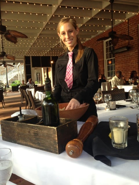 Server making a cesar salad