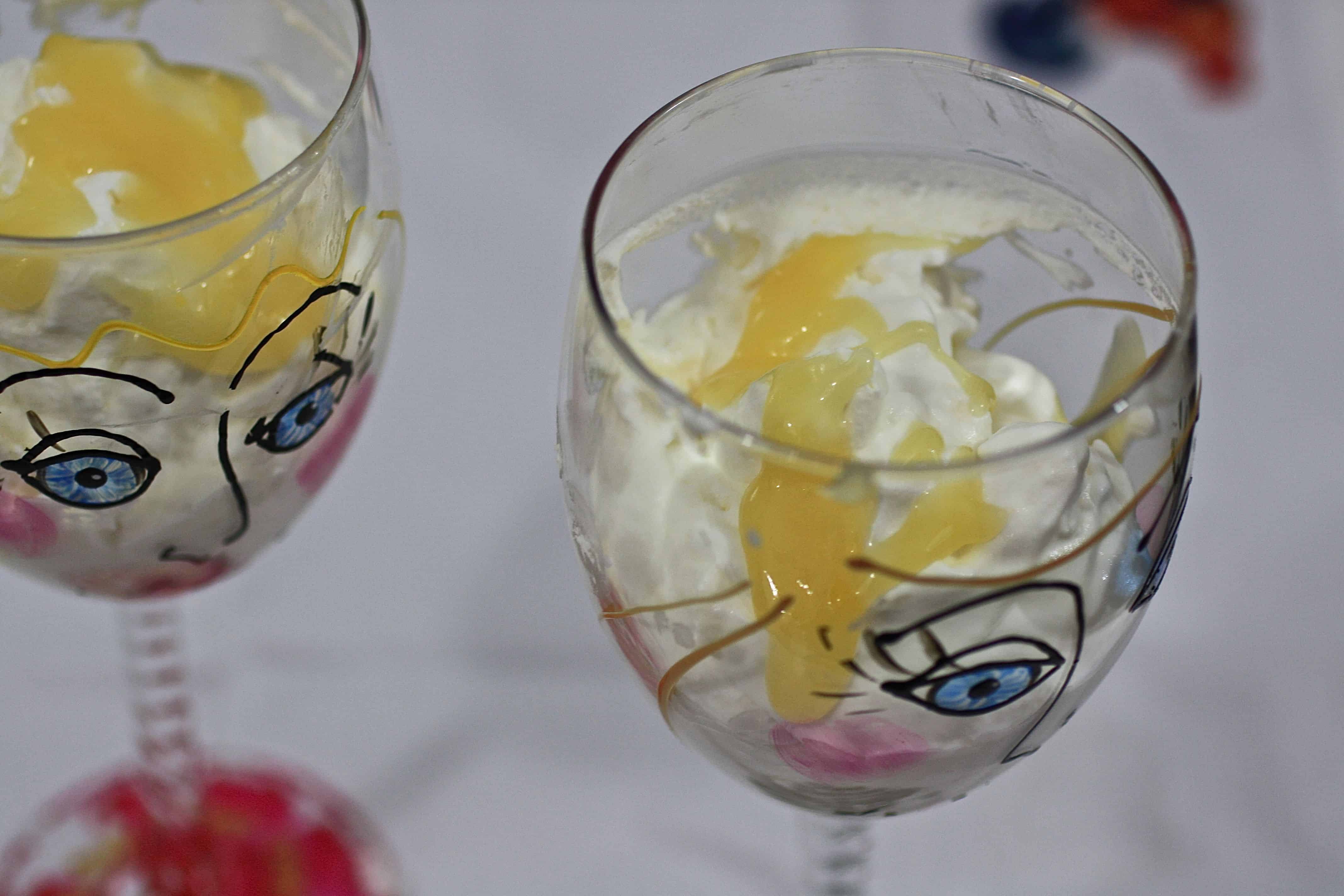 Two wine glasses filled with limoncello fool